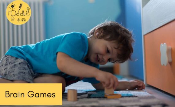 Child playing with a game and a caption that reads Brain Games